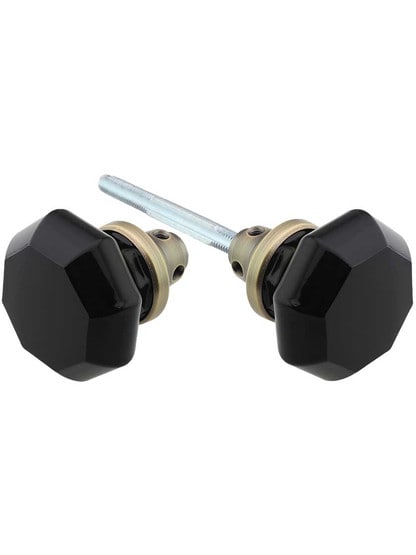 Pair of Black Octagonal Crystal Glass Door Knobs in Antique Brass.